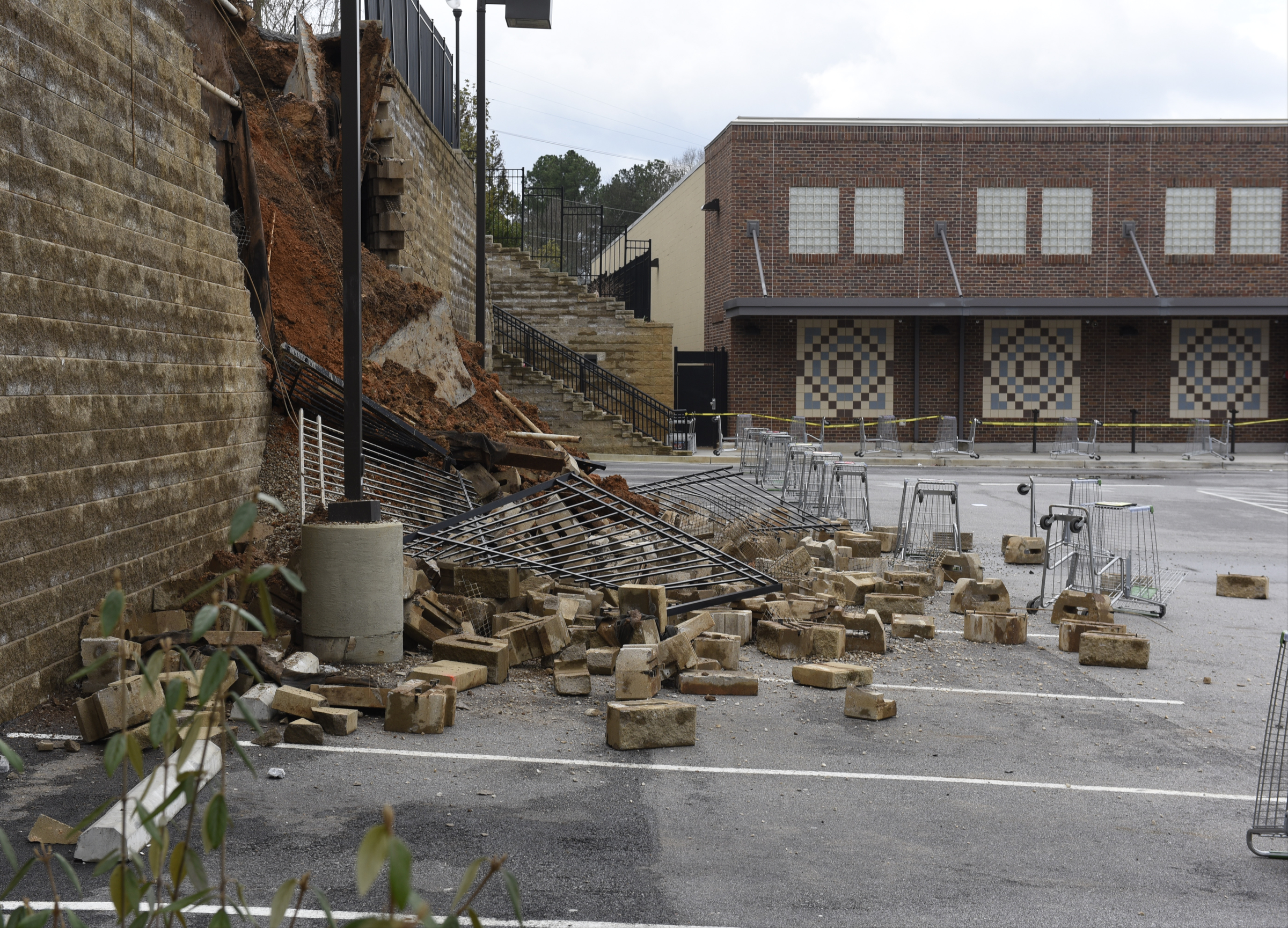 The collapsed wall of a Publix grocery store parking lot in the North Chattanooga community is seen on Thursday morning, Feb. 25, 2016, in Chattanooga, Tenn.