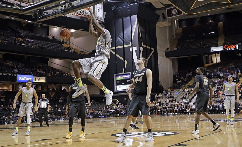 Vanderbilt guard Wade Baldwin IV, right, drives past Georgia guard Charles Mann during the Commodores' 80-67 victory this past Saturday in Nashville. The Commodores host Kentucky this Saturday.