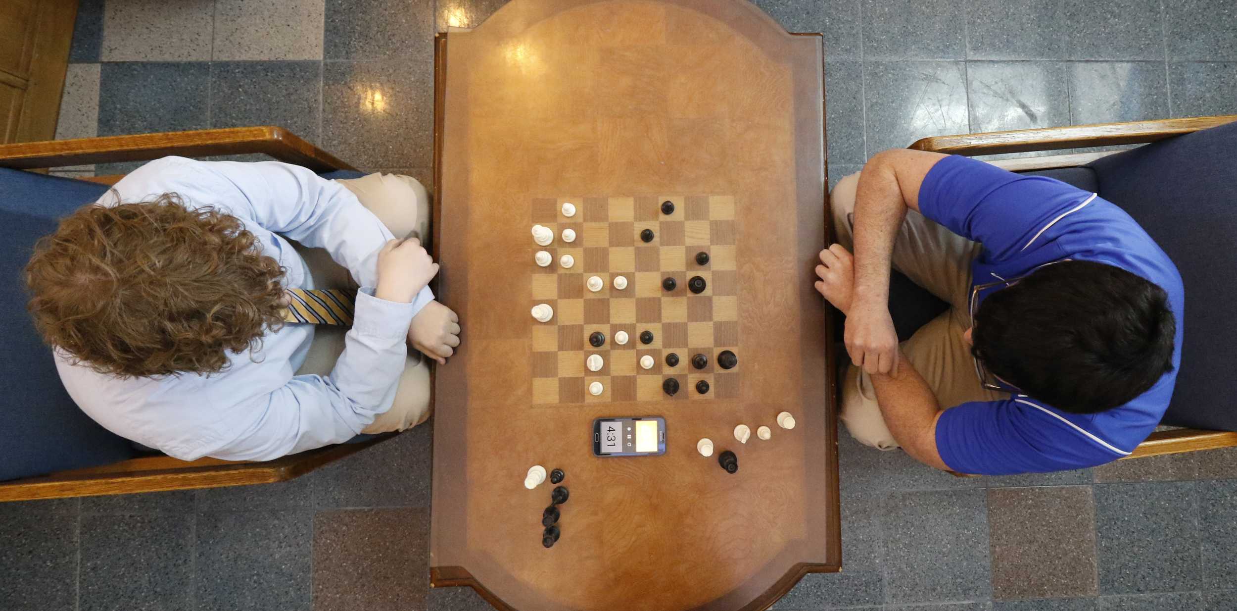 Staff Photo by Dan Henry / The Chattanooga Times Free Press- 2/19/16. McCallie School student Kaleb Gosdin, left, the Tennessee State Chess Champion, and fellow classmate Patrick Davis, play a quick match while in the middle school building on Friday, February 19, 2016.