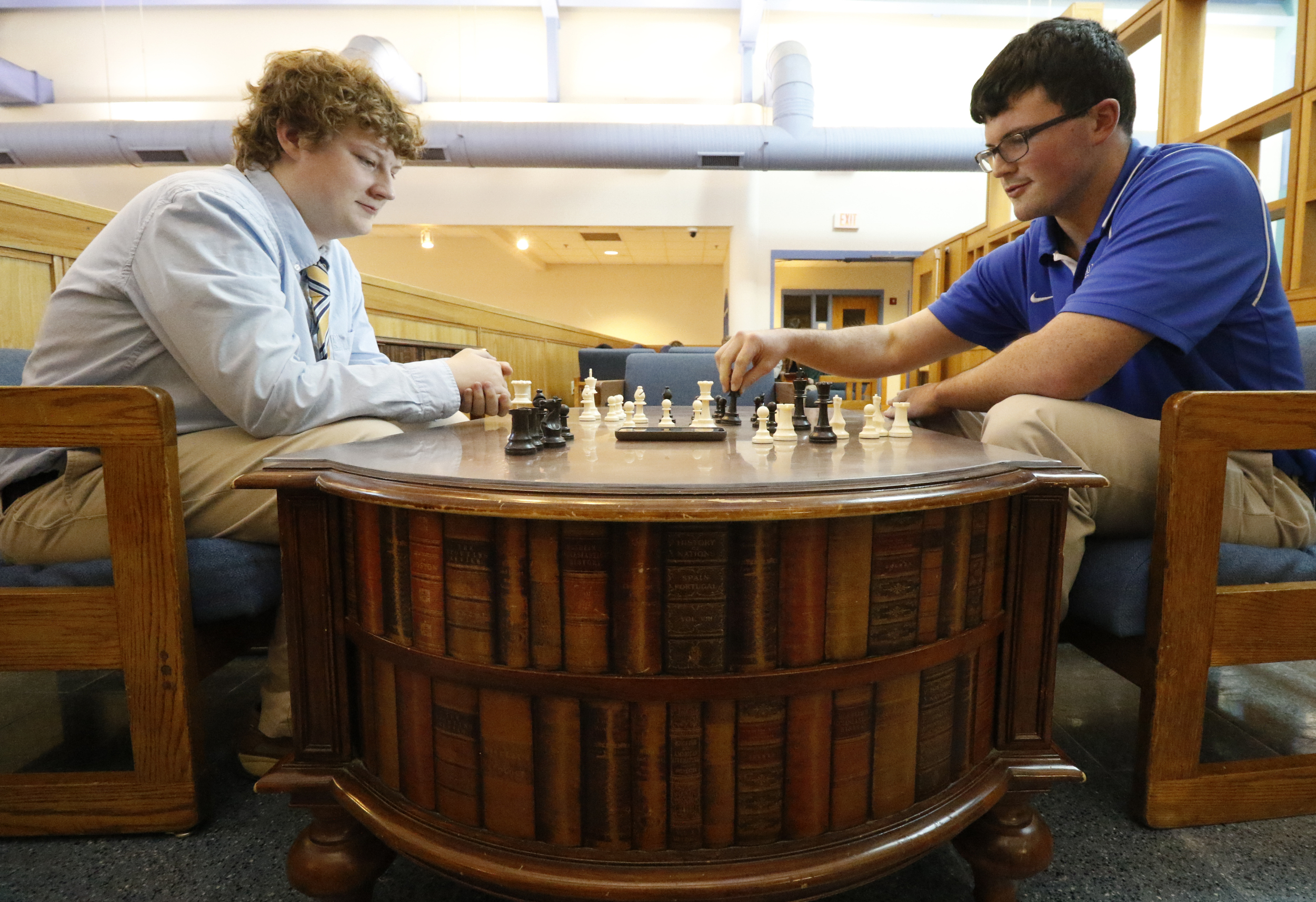 Staff Photo by Dan Henry / The Chattanooga Times Free Press- 2/19/16. McCallie School student Kaleb Gosdin, left, the Tennessee State Chess Champion, and fellow classmate Patrick Davis, play a quick match while in the middle school building on Friday, February 19, 2016.