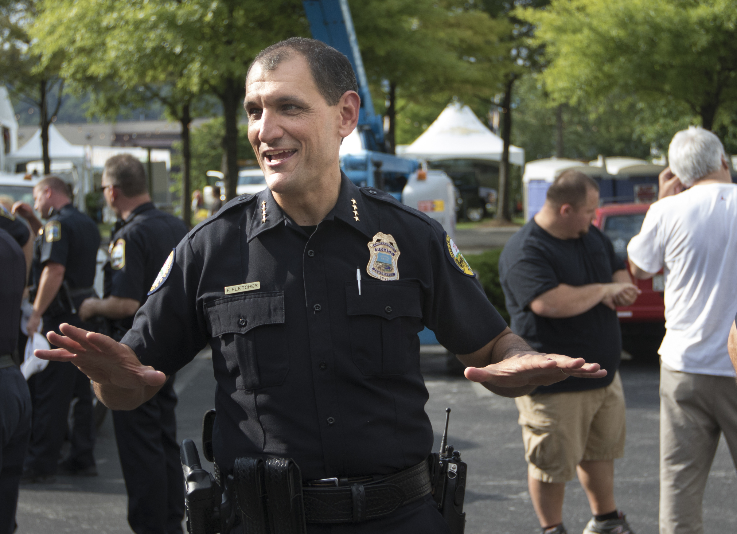 Chattanooga Police Chief Fred Fletcher talks to officers before a briefing on the first day of the Riverbend Festival at Ross's Landing in Chattanooga, Tenn.