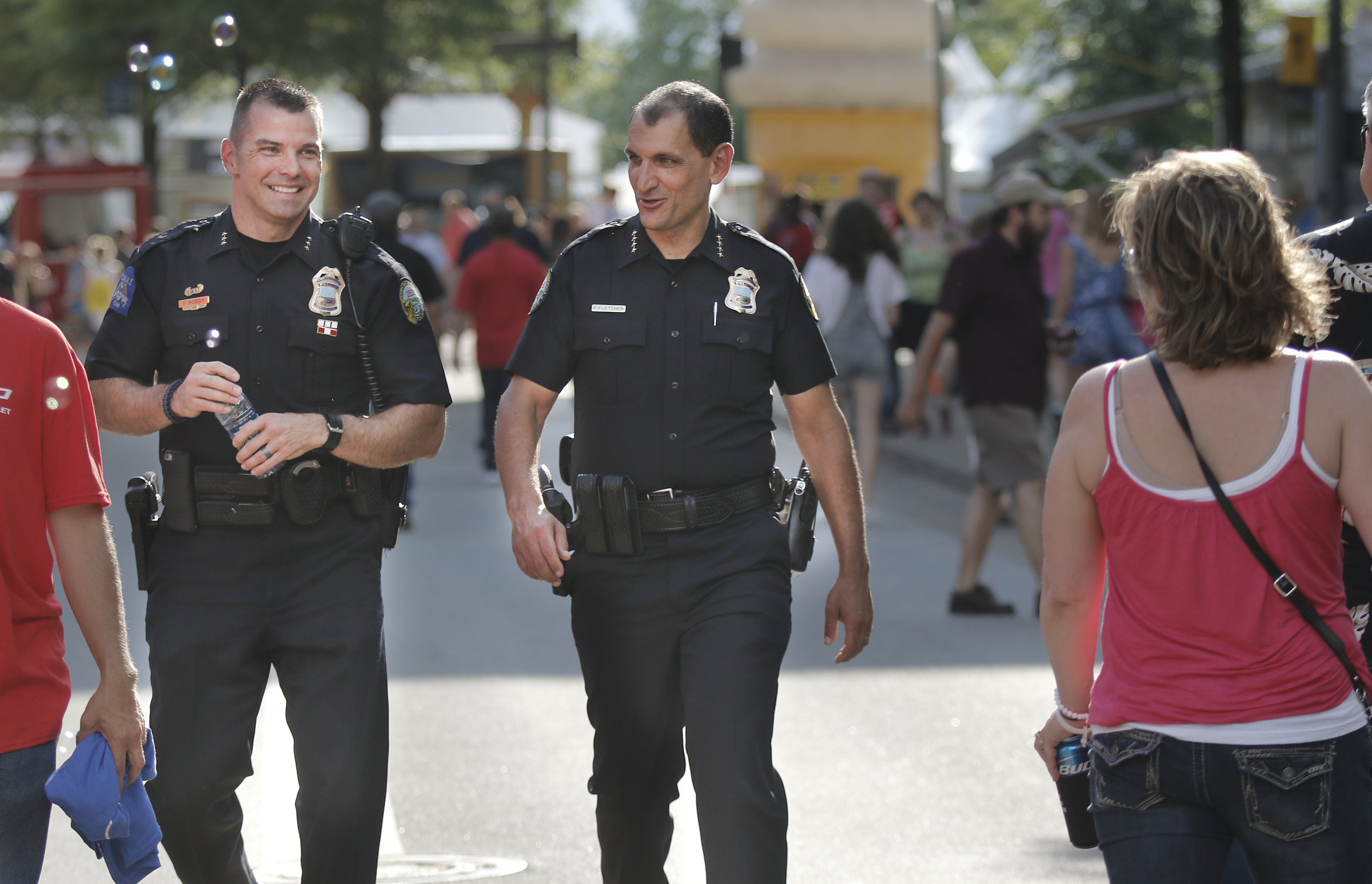 Chattanooga Police Chief Fred Fletcher, right, walks with Assistant Chief David Roddy on the first day of the Riverbend Festival at Ross's Landing in Chattanooga, Tenn.
