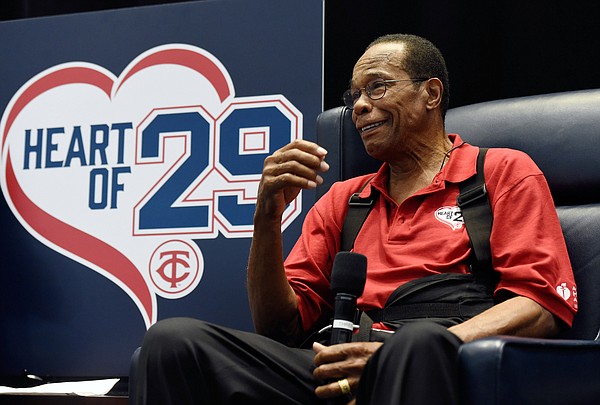 Hall of Fame member and former Minnesota Twins baseball player Rod Carew  holds his wife Rhoda's hand as speaks to fans about his recent heart attack  during TwinsFest, Saturday, Jan. 30, 2016