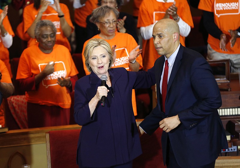 Democratic presidential candidate Hillary Clinton, left, seeks votes at an historically black church in Florence, S.C.