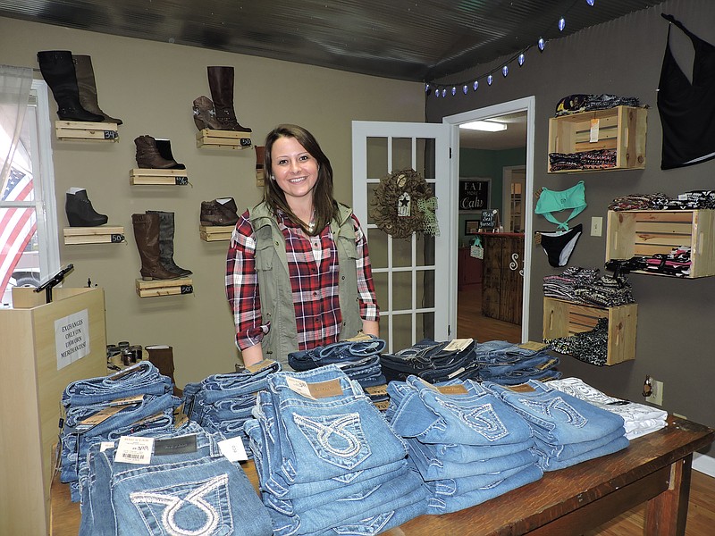 Southern Hanger Boutique co-owner Megan Hampton showcases the store's Silver, Big Star and Judy Blue jeans.