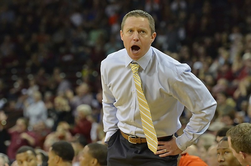 Florida head coach Mike White reacts during the first half of an NCAA college basketball game against South Carolina, Saturday, Feb. 20, 2016, in Columbia, S.C. (AP Photo/Richard Shiro)