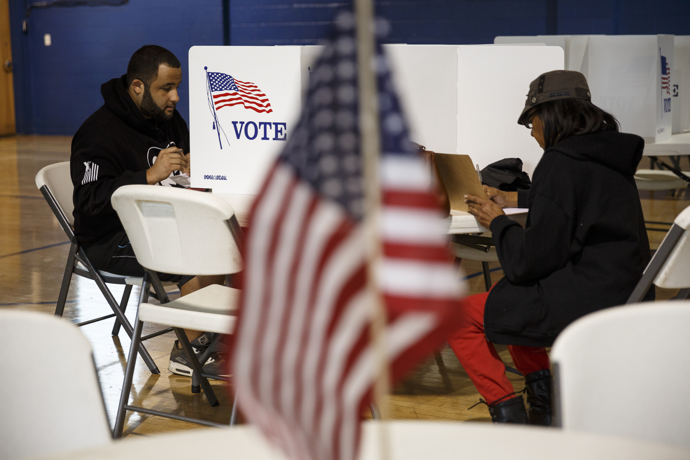 Verdell Stewart, left, votes in the Super Tuesday primary election at the Bethlehem Center polling location on Tuesday, March 1, 2016, in Chattanooga, Tenn.