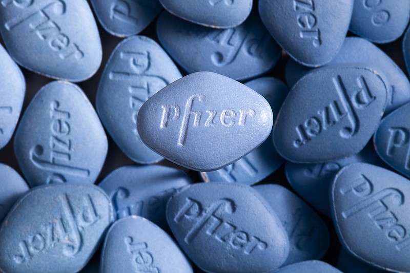 This undated photo provided by pfizer shows a real Viagra pill on top of counterfeit pills. In a first for the drug industry, Pfizer Inc. told The Associated Press on May 6, 2013, that it will sell erectile dysfunction pill Viagra directly to patients on its website. 
