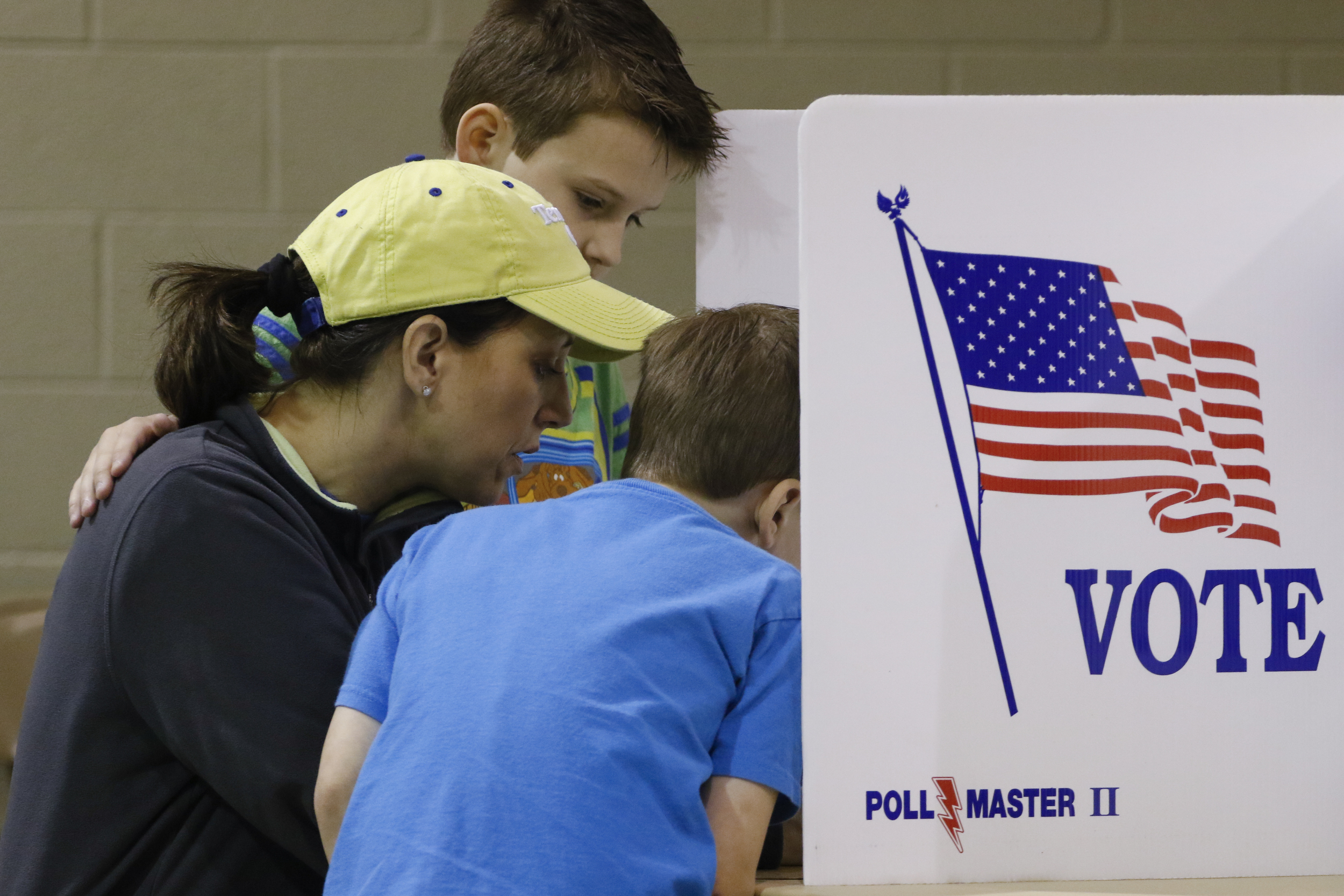 Tisha Walker teaches her sons Jonah, 9, and Micah, 7, how to vote while at Concord Baptist Church in East Brainerd on Super Tuesday, March 1, 2016.
