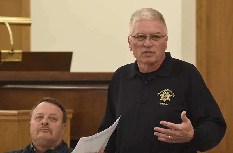 Walker County Sheriff Steve Wilson speaks at a community meeting at the Mission Glen Baptist Church on Tuesday, Mar. 1, 2016, near Rossville, Ga. The meeting was organized by David Roden, seated at left, in hopes to increase community involvement to address a number of issues in the Rossville and North Walker County areas.  