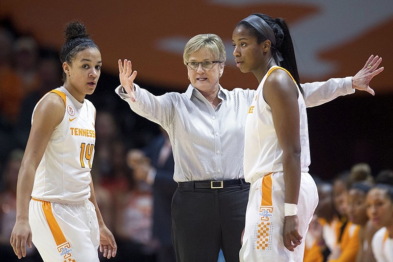 Tennessee head coach Holly Warlick giving directions to Andraya Carter, left, and Jordan Reynolds in the game against Georgia during an NCAA college basketball game in Knoxville, Tenn., on Sunday, Feb. 28, 2016.(Saul Young/Knoxville News Sentinel via AP)