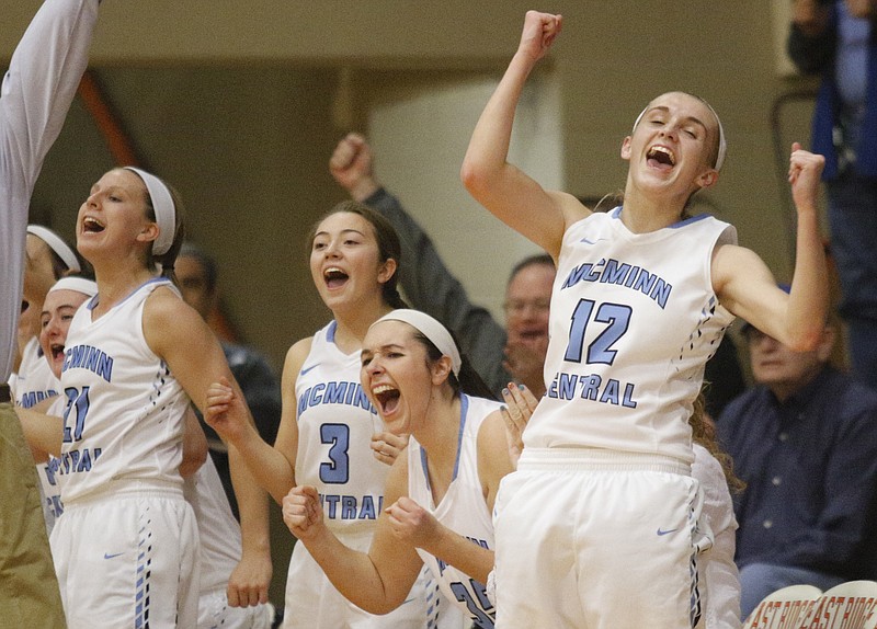 The McMinn Central bench cheers after a 3-pointer during their Region 3-AA basketball championship game against Sequoyah at East Ridge High School on Wednesday, March 2, 2016, in East Ridge, Tenn. McMinn Central won and took the regional championship title.