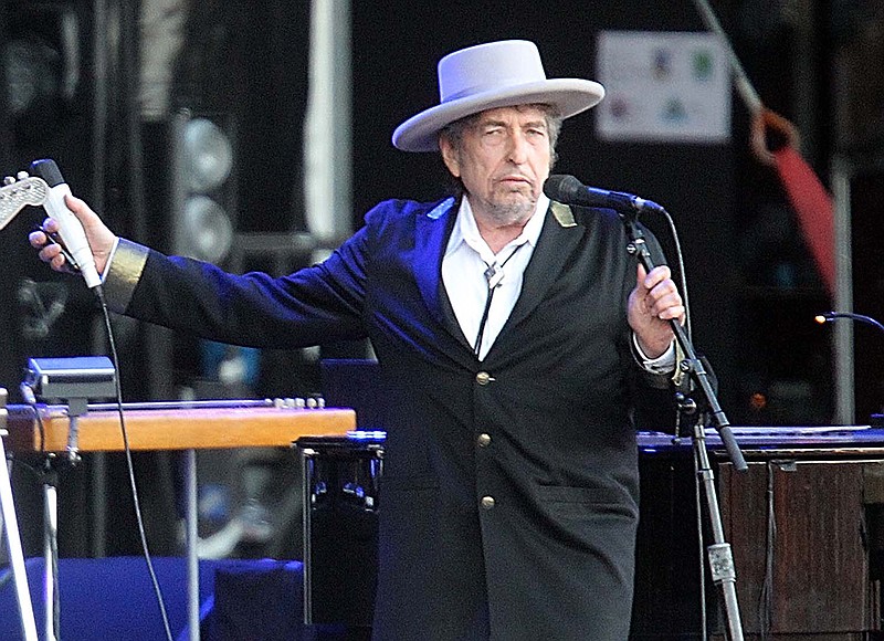
              FILE - This July 22, 2012 file photo shows U.S. singer-songwriter Bob Dylan performing on stage at "Les Vieilles Charrues" Festival in Carhaix, western France.  The archives of Dylan have been acquired by the George Kaiser Family Foundation and the University of Tulsa and will be permanently housed in Tulsa. Kaiser Foundation director Ken Levit and university President Steadman Upham announced the acquisition Wednesday, March 2, 2016. (AP Photo/David Vincent, file)
            