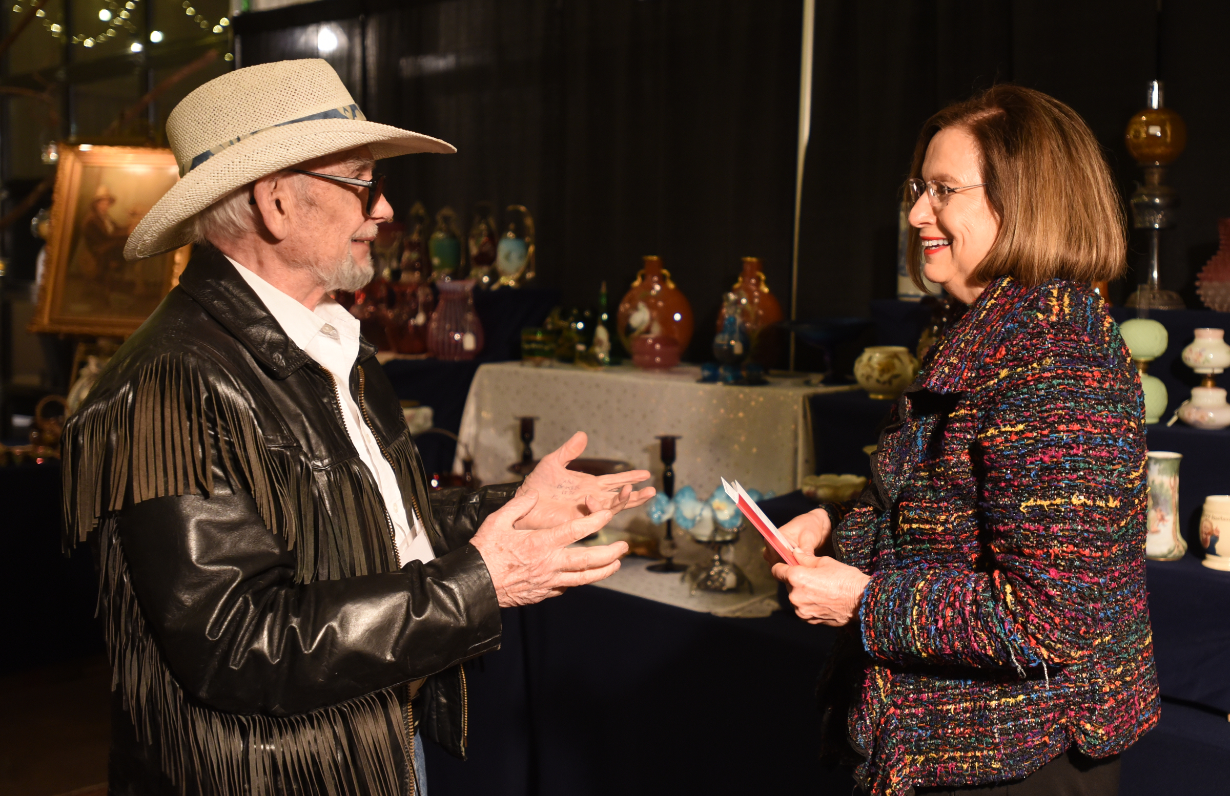 Steve Hallett, left, talks with Mary Helms.