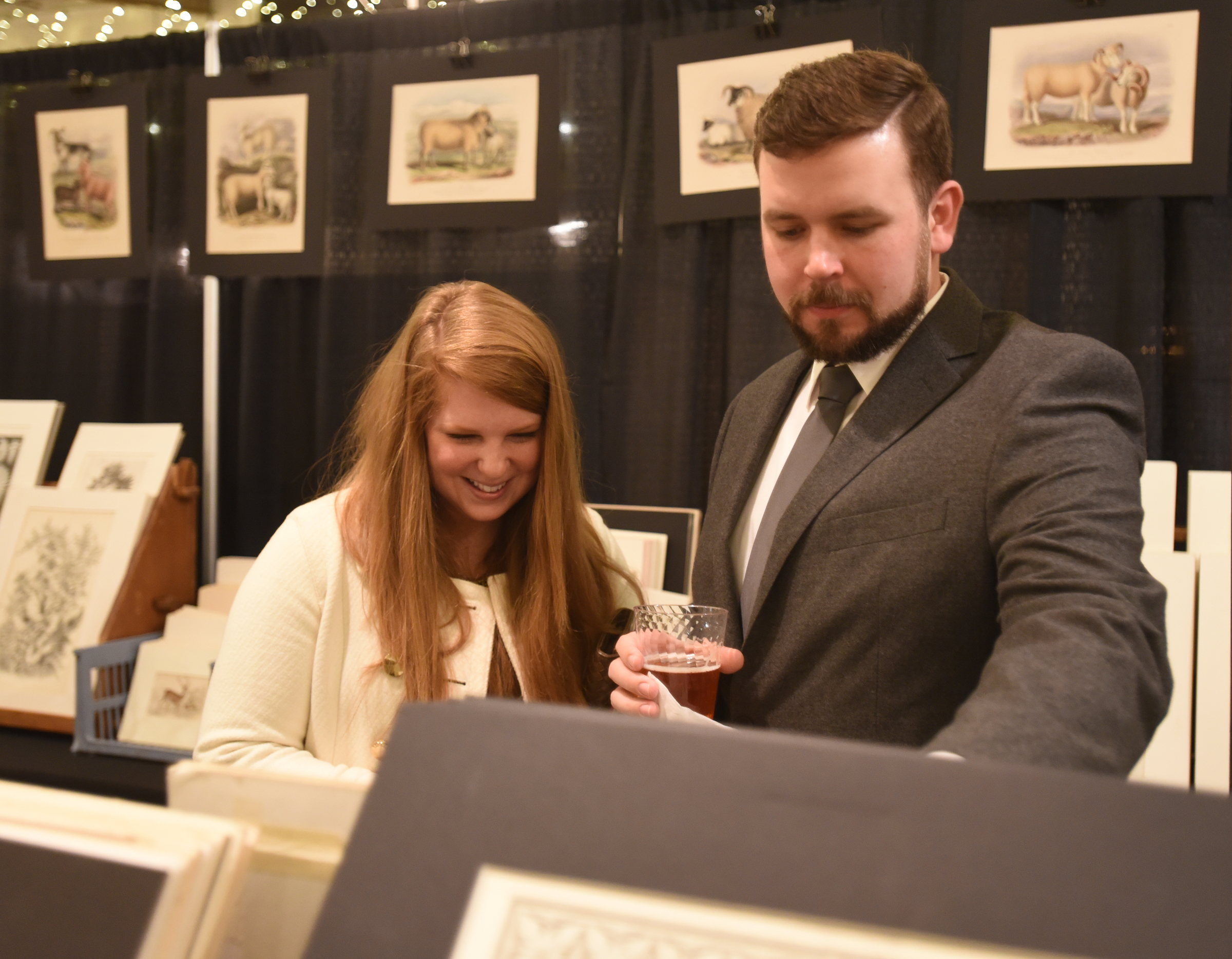 Lilly and Brad Waters browse artwork at the preview party.