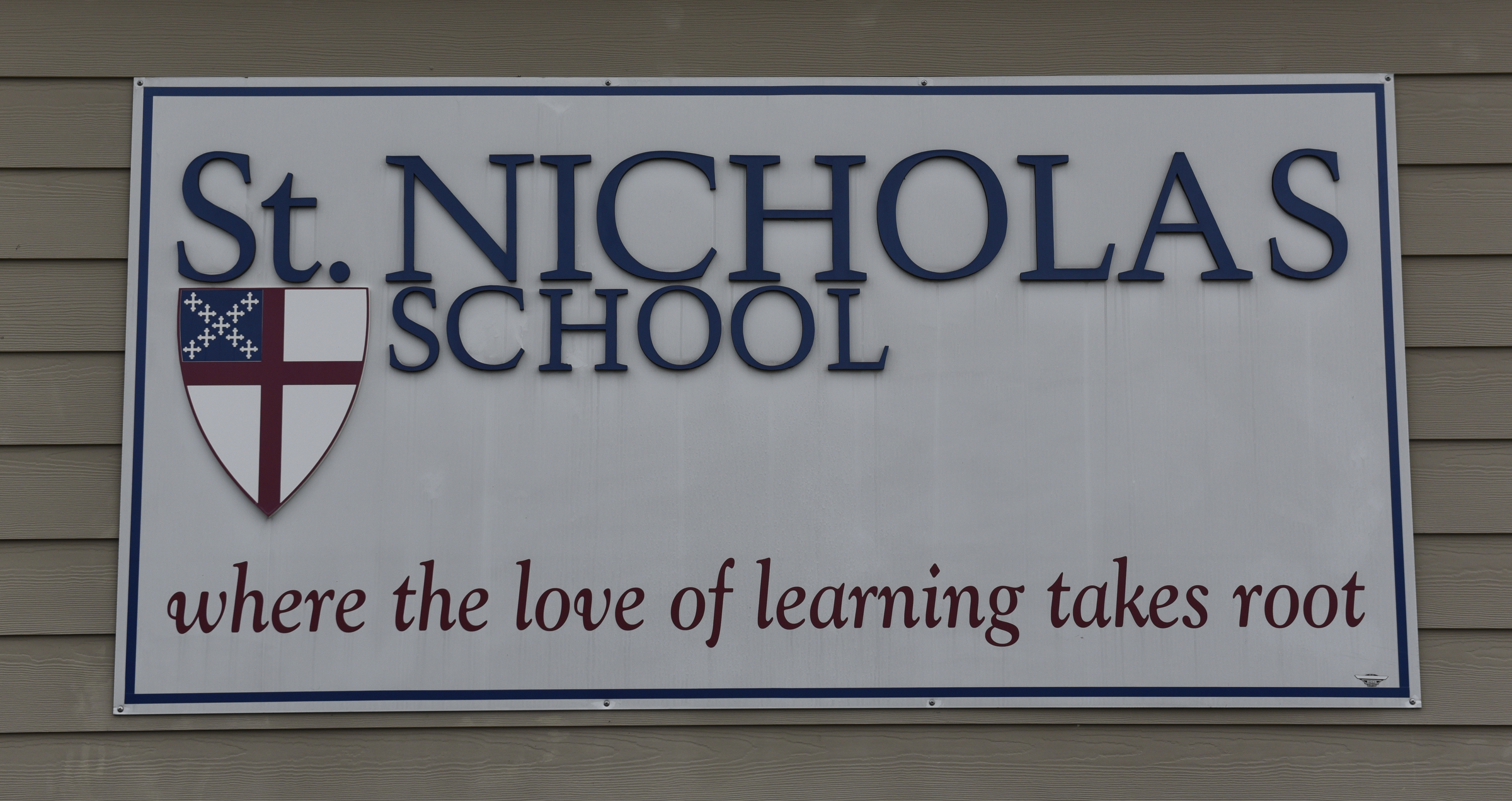 A school sign on the wall of the administration building on the campus of the St. Nicholas School is photographed Thursday, Mar. 3, 2016, in Chattanooga, Tenn. A chapel and fine arts building is being built, along with shelter rooms adjoining existing classroom buildings.