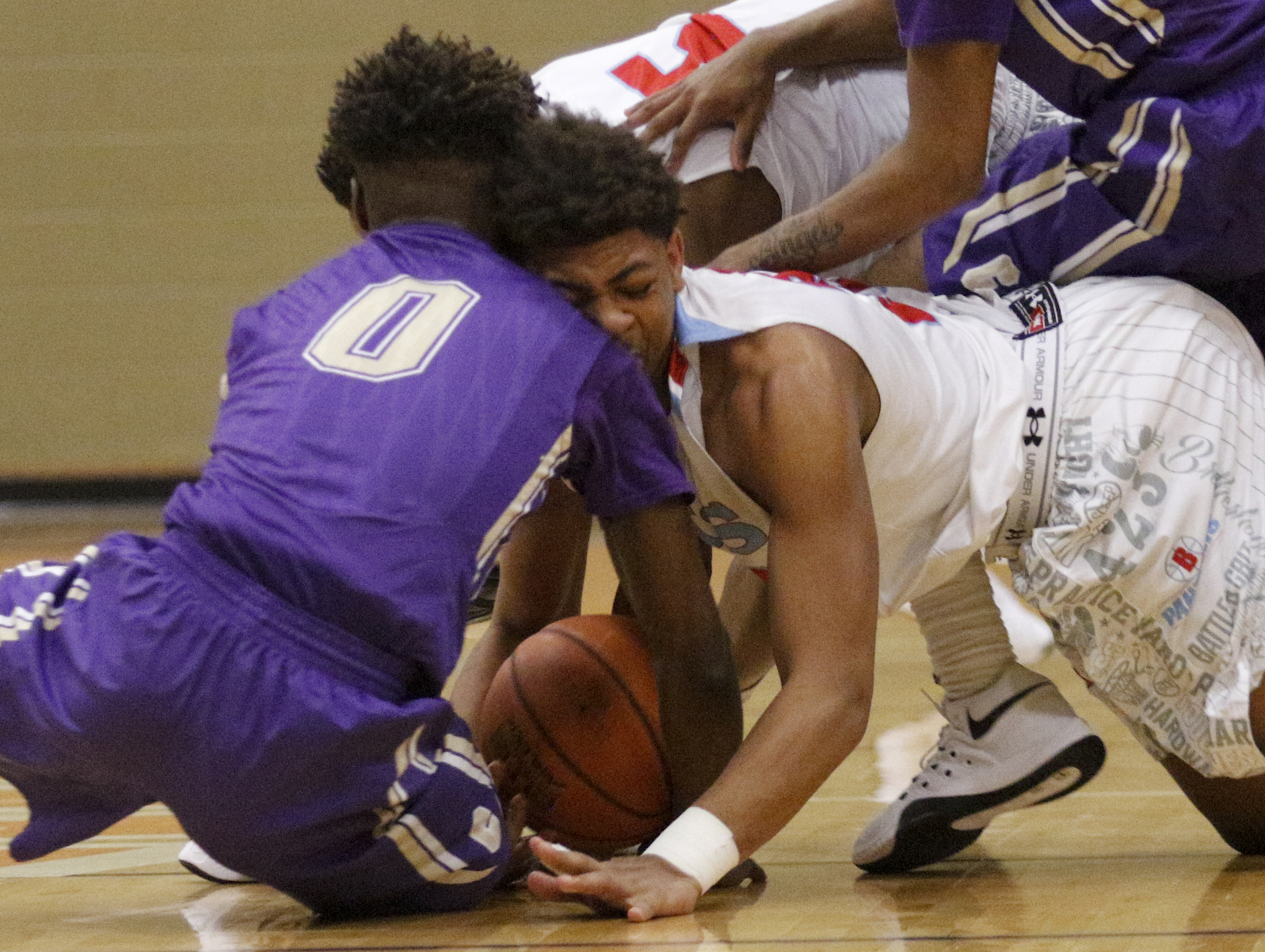 Central's Emmanuel Lane (0) and Brainerd's Jessie Walker collide head-on while chasing a loose ball during their Region 3-AA boys' basketball tournament championship game at East Ridge High School on Thursday, March 3, 2016, in East Ridge, Tenn.
