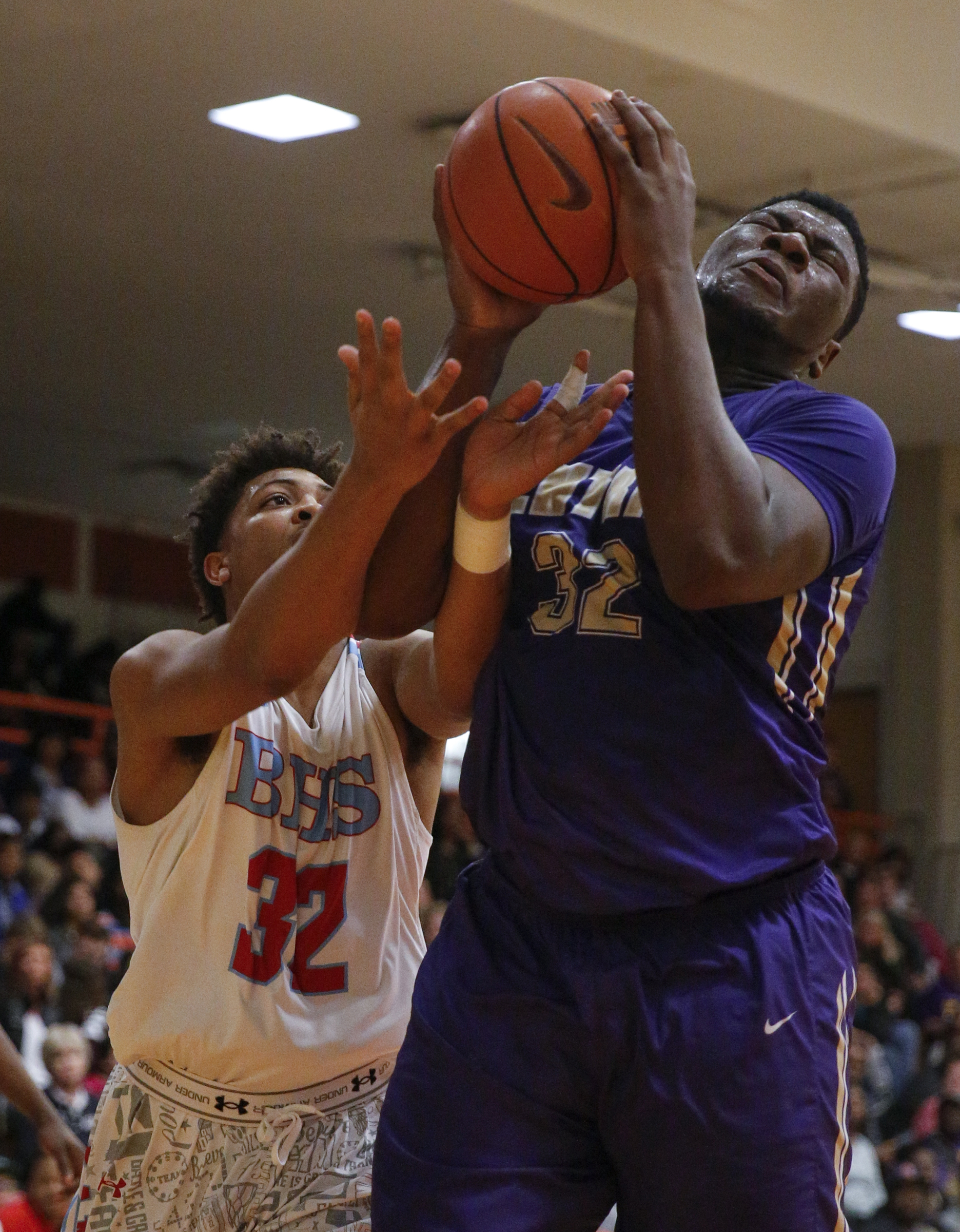 Central's McClendon Curtis, right, rebounds ahead of Brainerd's Jessie Walker during their Region 3-AA boys' basketball tournament championship game at East Ridge High School on Thursday, March 3, 2016, in East Ridge, Tenn.