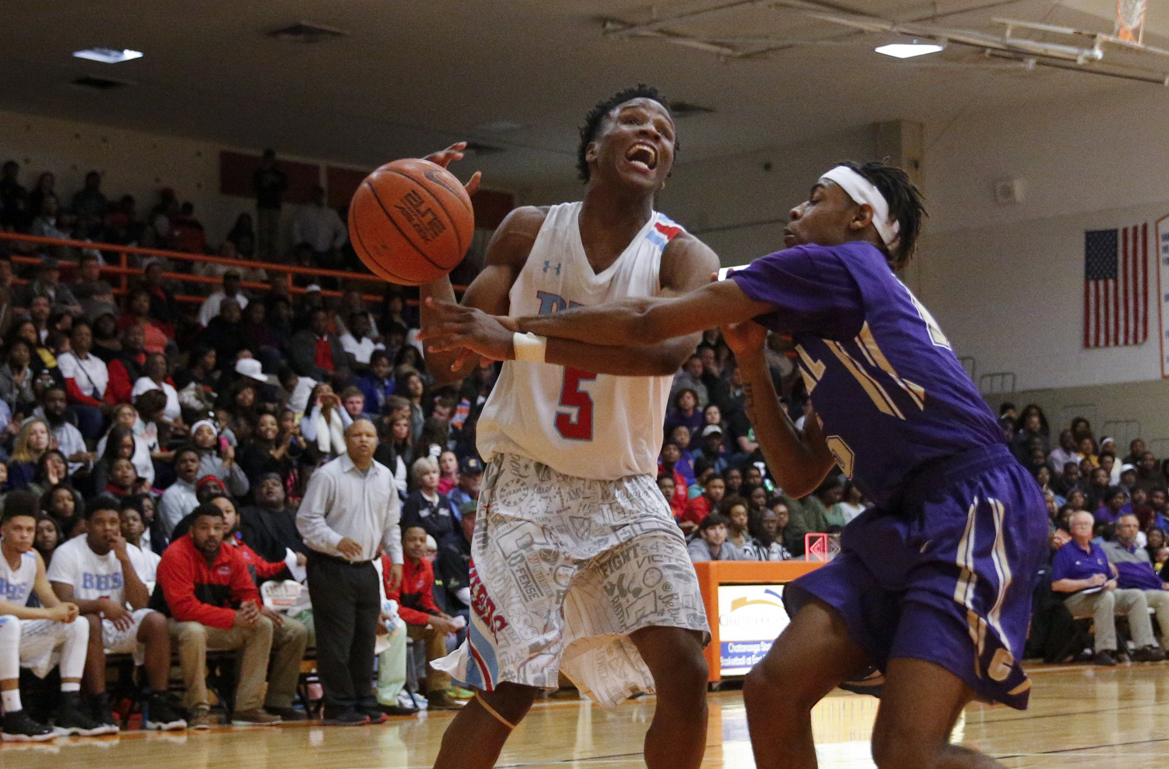 Central's Rodney Benford, right, knocks the ball free from the hands of Brainerd's Dajuonta Ross during their Region 3-AA boys' basketball tournament championship game at East Ridge High School on Thursday, March 3, 2016, in East Ridge, Tenn.