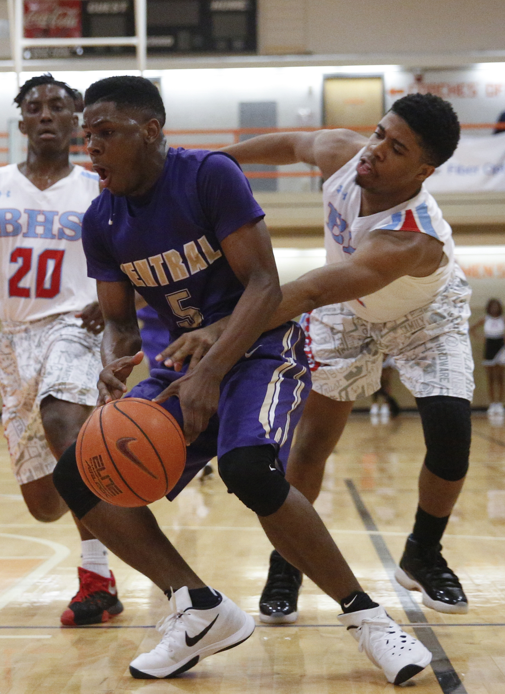 Brainerd's Isaih Shropshire, right, knocks the ball away from Central's Terron Hayes during their Region 3-AA boys' basketball tournament championship game at East Ridge High School on Thursday, March 3, 2016, in East Ridge, Tenn.
