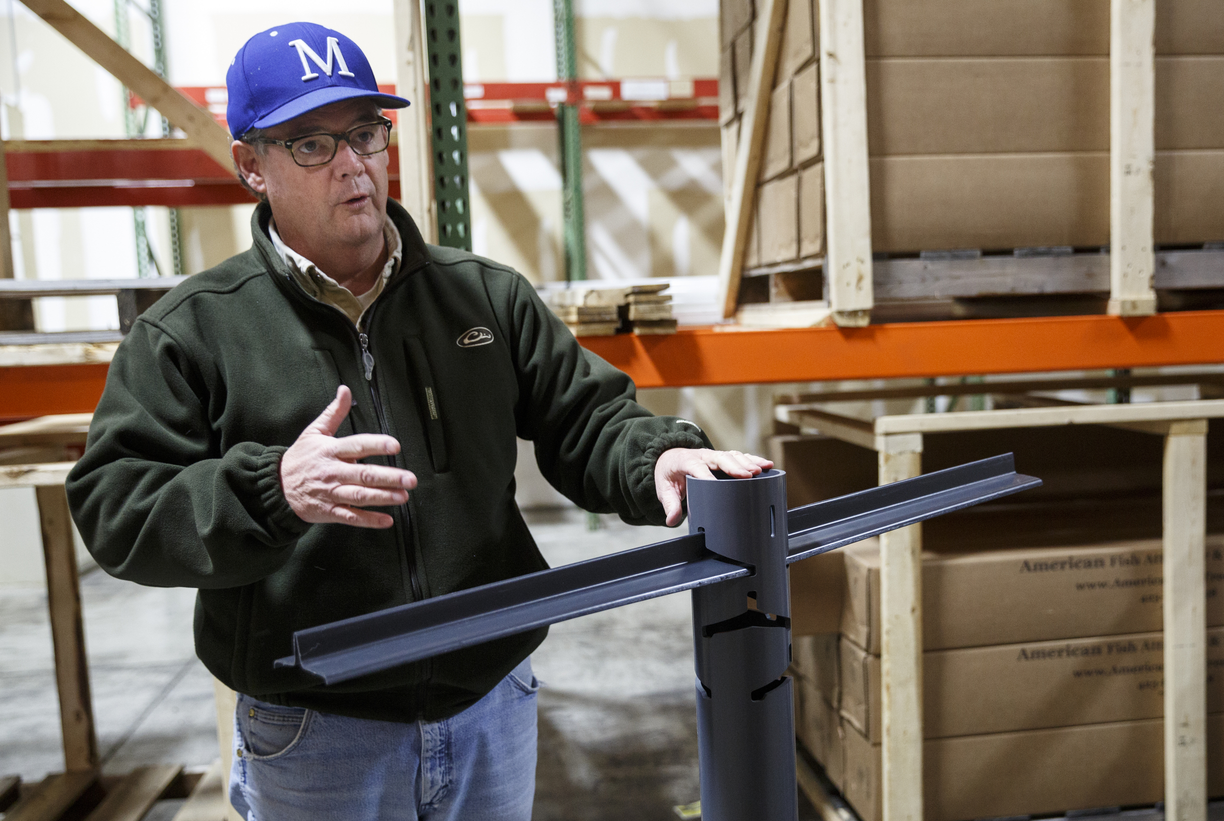 Businessman Matt Marsden talks about his fish attractor, called the American Fish Tree, as he assembles it at a warehouse Friday, Feb. 19, 2016, in Soddy-Daisy, Tenn. The device, which is made from PVC, can be dropped into a lake to provide an artificial fish habitat by providing shelter and shade.