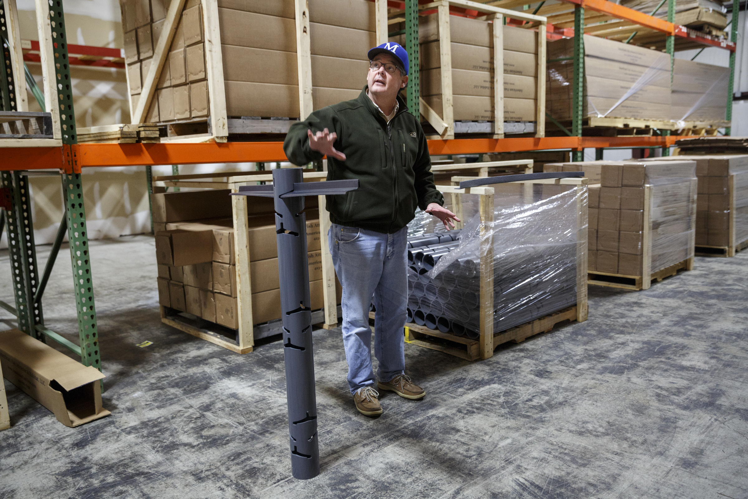 Businessman Matt Marsden talks about his fish attractor, called the American Fish Tree, as he assembles it at a warehouse Friday, Feb. 19, 2016, in Soddy-Daisy, Tenn. The device, which is made from PVC, can be dropped into a lake to provide an artificial fish habitat by providing shelter and shade.