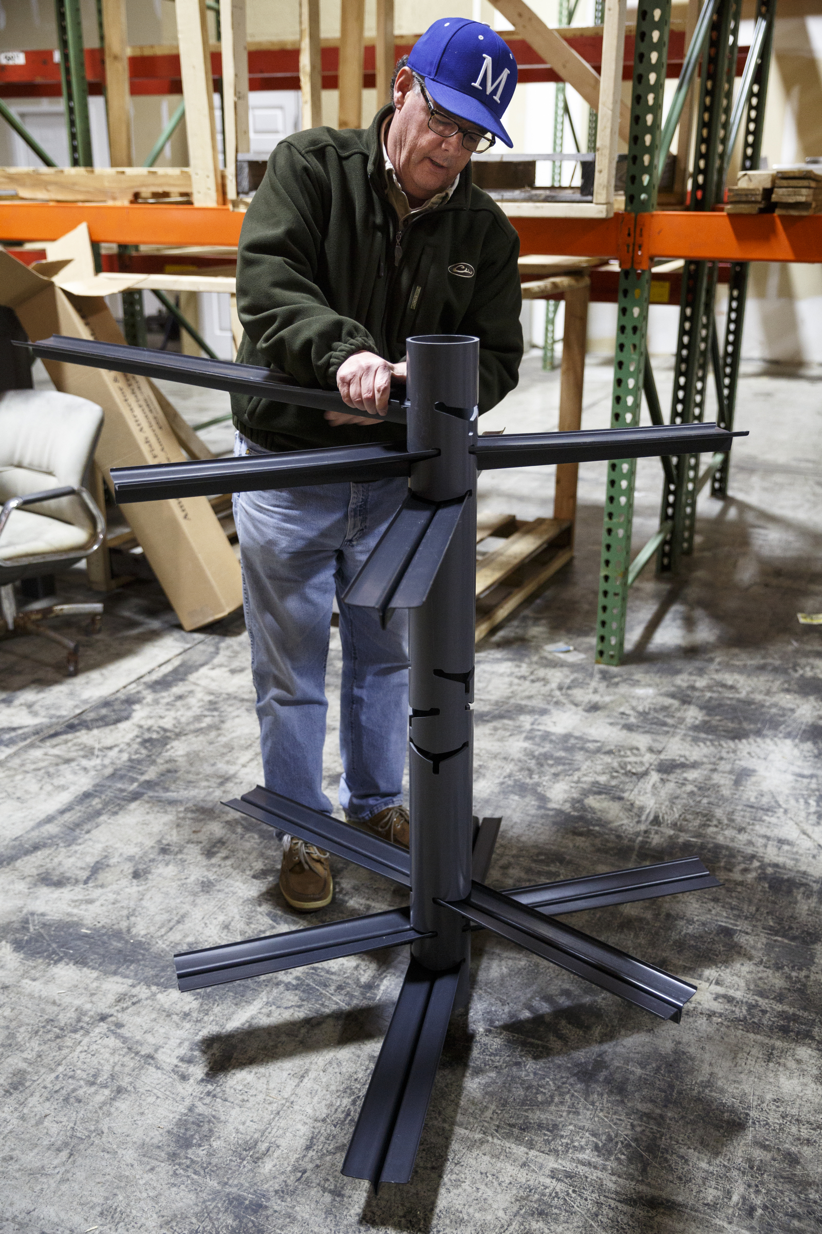 Businessman Matt Marsden talks about his fish attractor, called the American Fish Tree, as he assembles it at a warehouse Friday, Feb. 19, 2016, in Soddy-Daisy, Tenn. The device, which is made from PVC, can be dropped into a lake to provide an artificial fish habitat by providing shelter and shade.