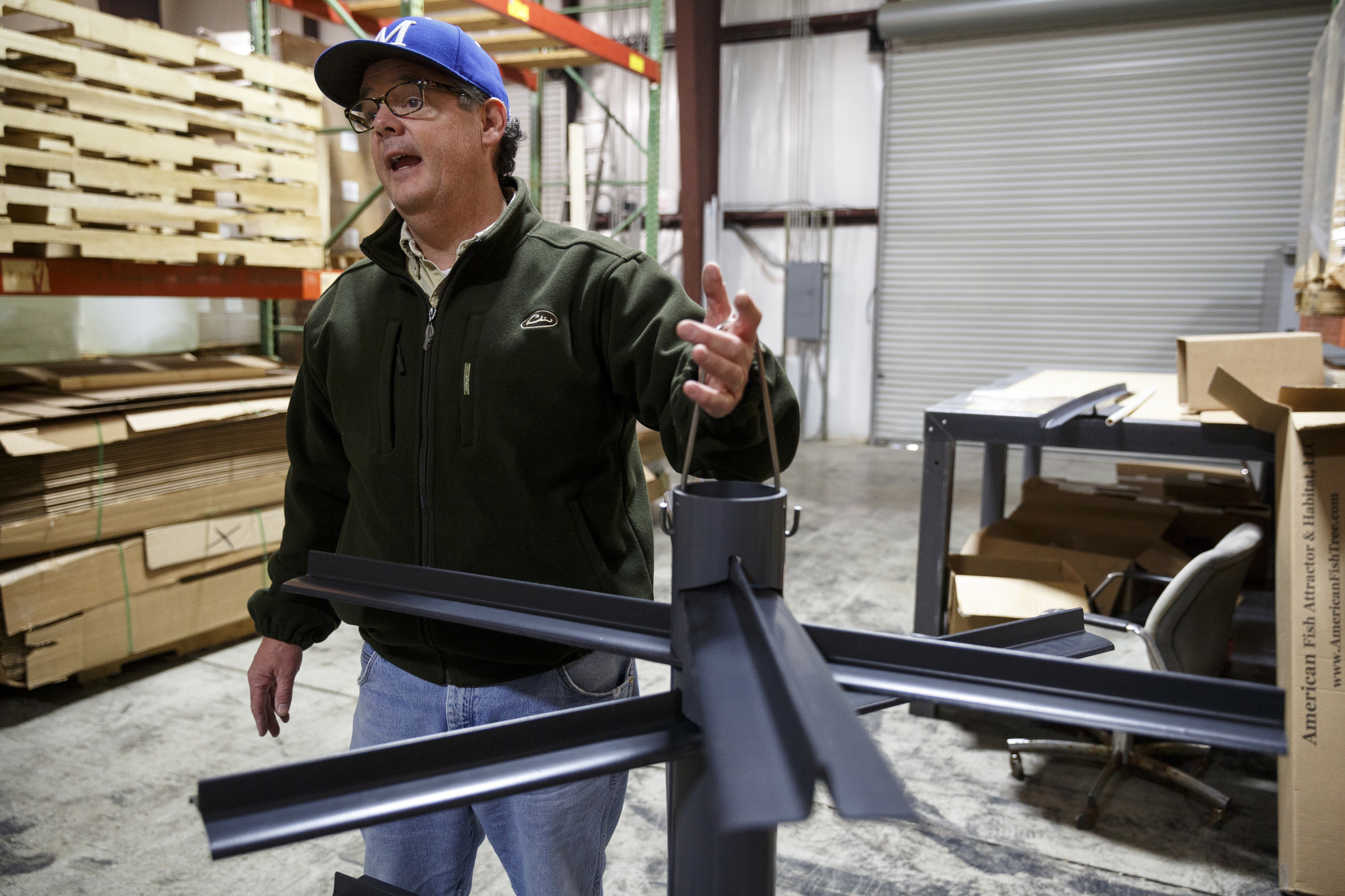 Businessman Matt Marsden talks about how he patented a unique handle for his fish attractor, called the American Fish Tree, as he assembles it at a warehouse Friday, Feb. 19, 2016, in Soddy-Daisy, Tenn. The device, which is made from PVC, can be dropped into a lake to provide an artificial fish habitat by providing shelter and shade.
