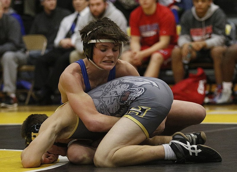 Red Bank's Jonah Bird, top, wrestles Hixson's Konner Zeigler during a January match at Hixson. Red Bank won the Class A/AA state duals title this season, but the Lions don't have funds to purchase commemorative championship rings.