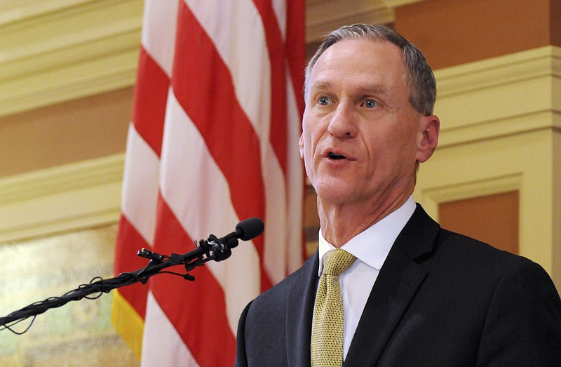 In this Jan. 12, 2016, file photo, South Dakota Gov. Dennis Daugaard delivers his during his annual state of the state address at the state Capitol in Pierre. Daugaard vetoed a bill Tuesday, March 1, 2016, that would have made it the first state in the U.S. to approve a law requiring transgender students to use the bathrooms and locker rooms that match their sex at birth.