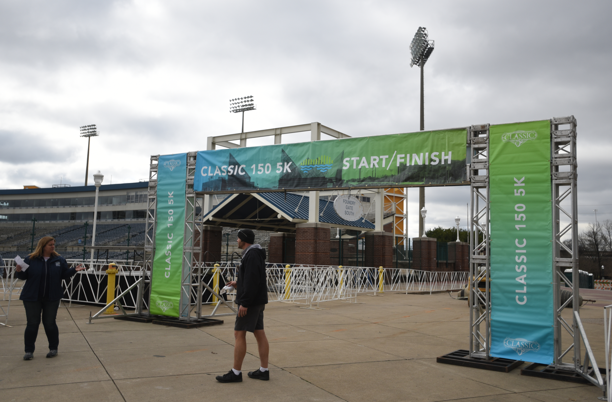 People talk near the start and finish line Friday, March 4, 2016 at First Tennessee Pavilion for Sunday's inaugural Erlanger Chattanooga Marathon.
