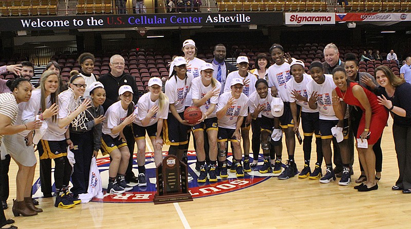 The Mocs celebrate defeating Mercer 65-57 to win SoCon Women championship game. March 6, 2016