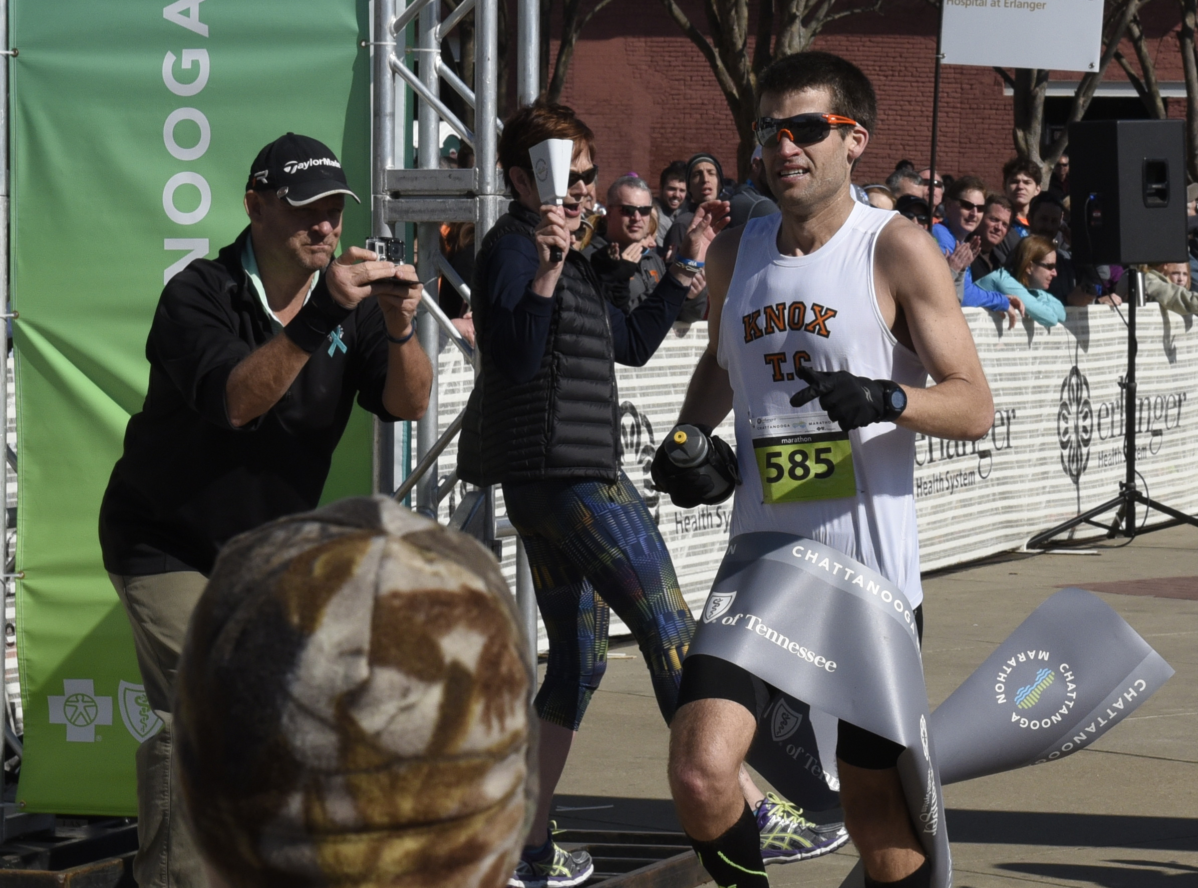 Full marathon winner Bob Adams crosses the finish line during the first running of the Chattanooga Marathon on Sunday, Mar. 6, 2016, in Chattanooga, Tenn.