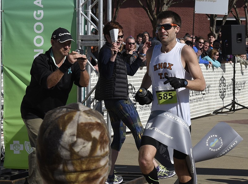 Full marathon winner Bob Adams crosses the finish line during the first running of the Chattanooga Marathon on Sunday, Mar. 6, 2016, in Chattanooga, Tenn. 