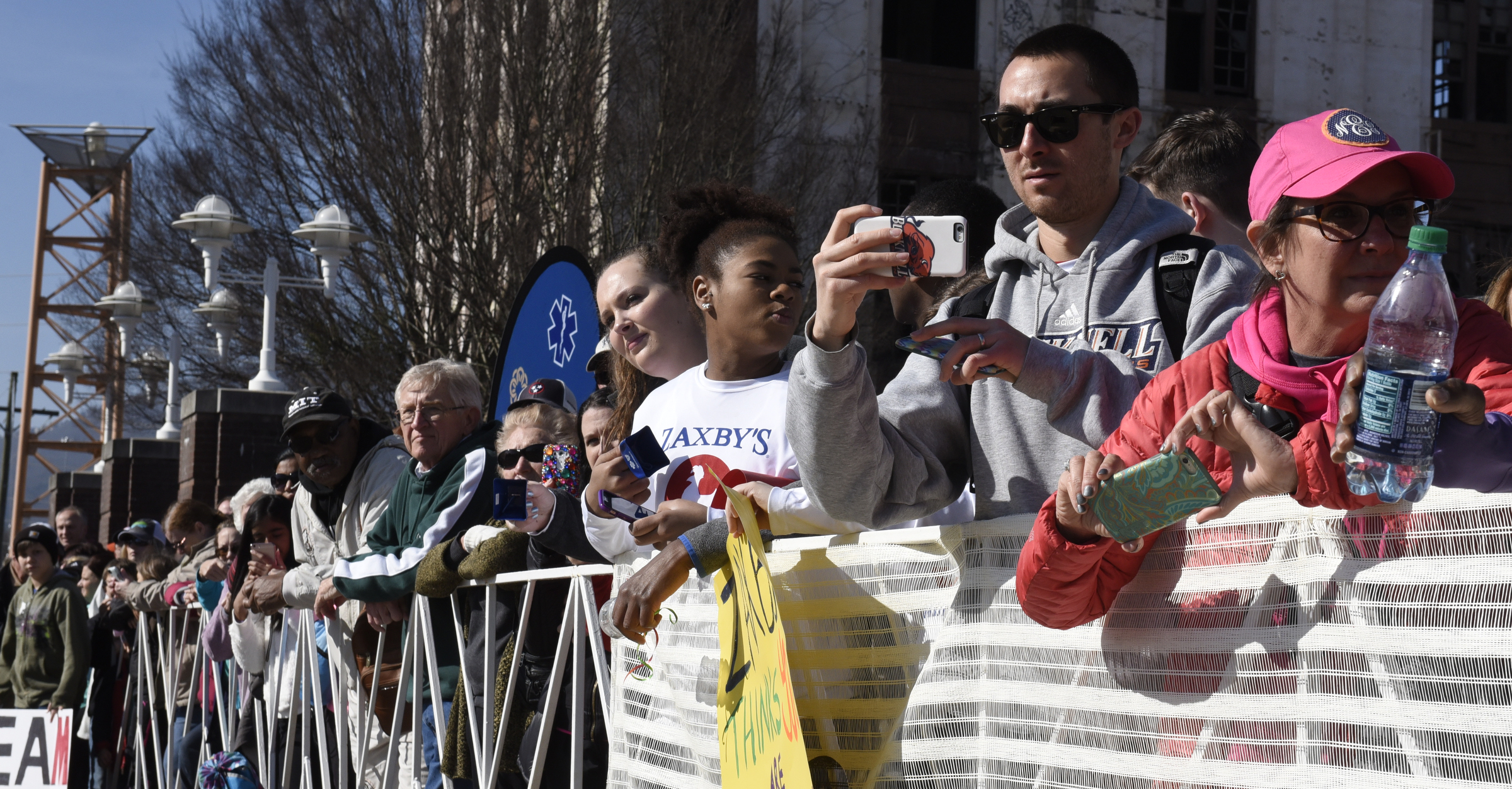 Spectators watch at the finish line next to Finley Stadium during the first running of the Chattanooga Marathon on Sunday, Mar. 6, 2016, in Chattanooga, Tenn.