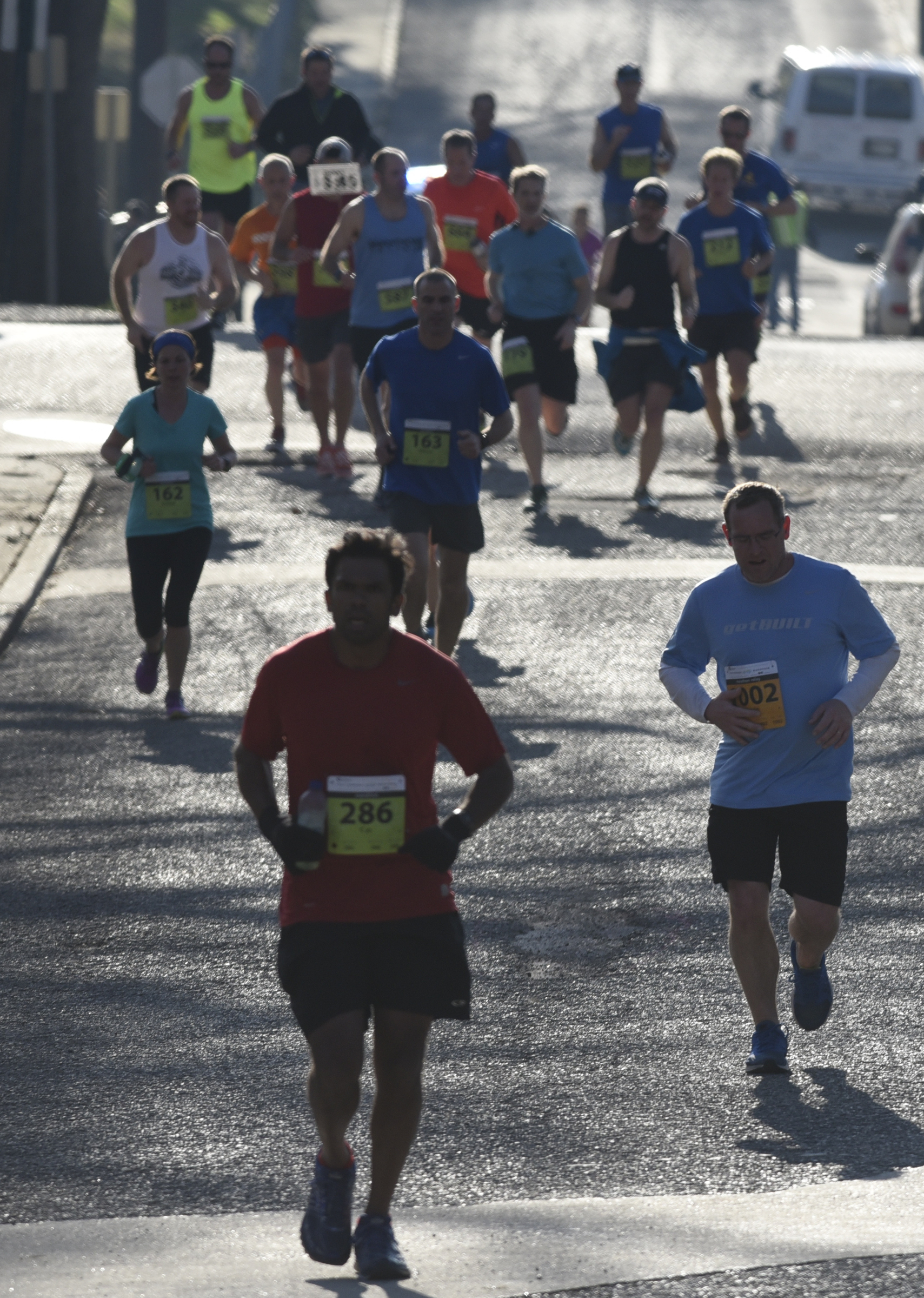 Runners proceed west on 49th Street in St. Elmo as they make a turn headed back toward downtown during the first running of the Chattanooga Marathon on Sunday, Mar. 6, 2016, in Chattanooga, Tenn.