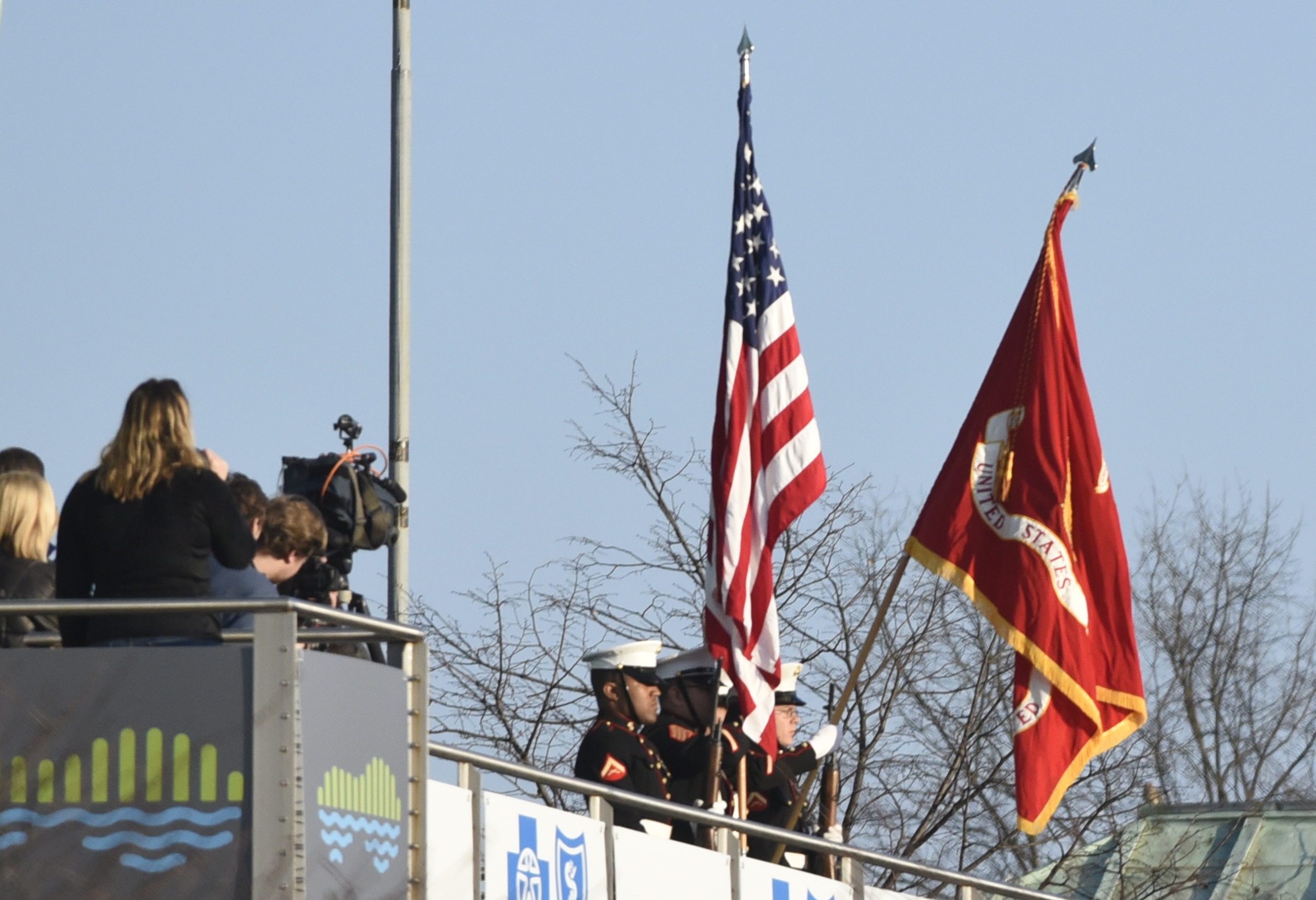 Haley Graham, left, sings the National Anthem as a Marine Color Guard displays the flag just before the start of the first running of the Chattanooga Marathon on Sunday, Mar. 6, 2016, in Chattanooga, Tenn.