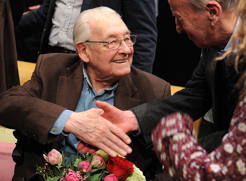 
              In this Thursday, March 3, 2016 photo Academy Award winning Polish film director Andrzej Wajda shakes hands with a spectator during the opening of a review of some of his movies held on the occasion of his birthday, in Warsaw, Poland. Wajda, who turns 90 on March 6, 2016, is currently working on his latest film. (AP Photo/Alik Keplicz)
            