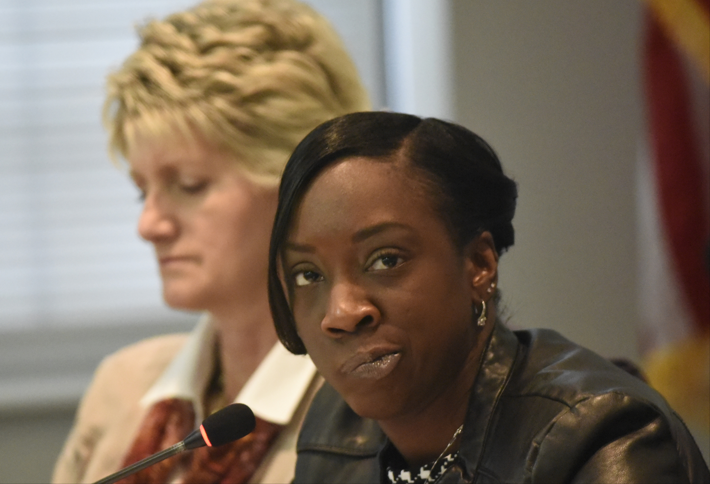 Board member Karitsa Mosley, right, makes a facial expression after discussing her mixed feelings during the meeting of the Hamilton County School Board on Monday, Mar. 7, 2016, in Chattanooga, Tenn. At left is board member Rhonda Thurman. The board declined to take action, leaving Rick Smith in place as superintendent.