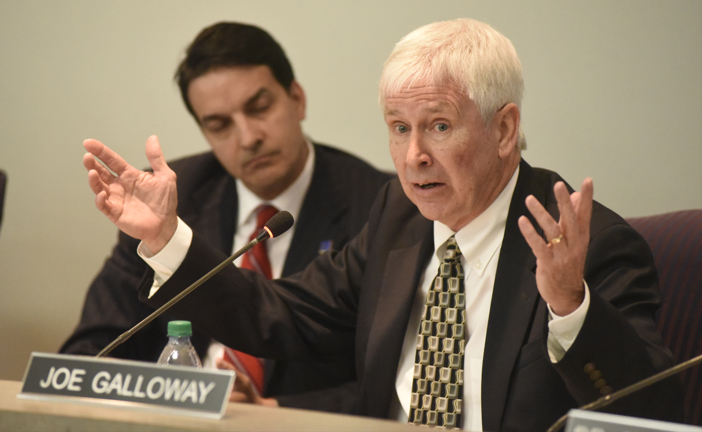 Board member Joe Galloway, right, speaks while Dr. Greg Martin listens during the meeting of the Hamilton County School Board on Monday, Mar. 7, 2016, in Chattanooga, Tenn. The board declined to take action, leaving Rick Smith in place as superintendent.