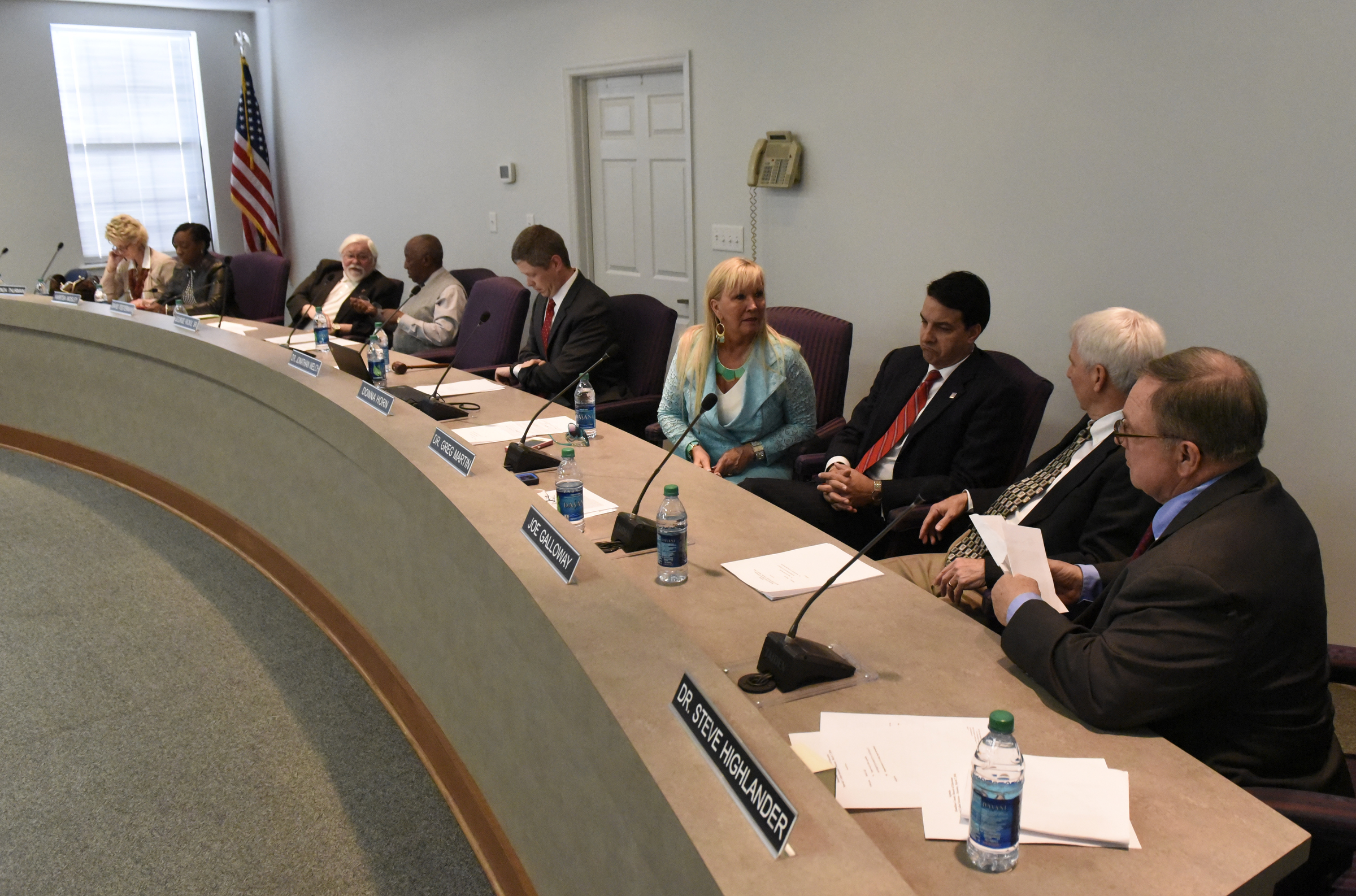 Members of the Hamilton County School Board chat prior to the start of their meeting on Monday, Mar. 7, 2016, in Chattanooga, Tenn.