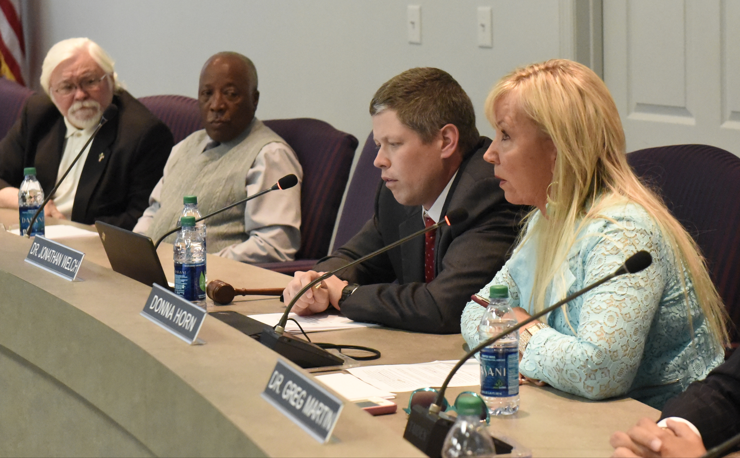 Dr. Jonathan Welch, second from right, speaks during the meeting of the Hamilton County School Board on Monday, Mar. 7, 2016, in Chattanooga, Tenn., while David Testerman, George Ricks, Sr., and Donna Horn, from left, listen. The board declined to take action, leaving Rick Smith in place as superintendent.