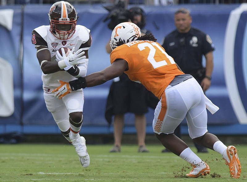 Bowling Green's Travis Greene (8) tries to get around Tennessee's Jalen Reeves-Maybin (21).  The Tennessee Volunteers hosted the Bowling Green Falcons at Nissan Stadium in Nashville September 5, 2015.