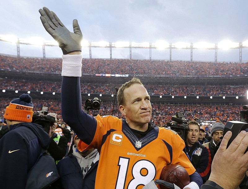 In this Jan. 24, 2016, file photo, Denver Broncos quarterback Peyton Manning waves to spectators following the AFC Championship game between the Denver Broncos and the New England Patriots, in Denver. (AP Photo/Chris Carlson, File)
            