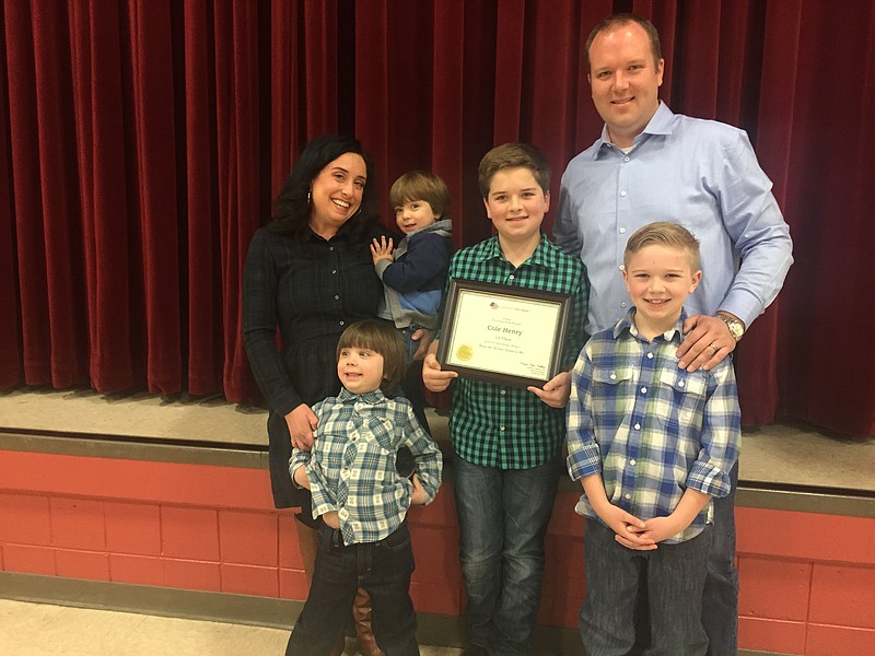 Christa Henry stands with her boys: 21-month old Cavenaugh, 4-year-old Crosby, 8-year-old Cullen, 11-year-old Cole and husband Kevin. The family surprised Cole at an assembly at Apison Elementary School to celebrate his contest win.