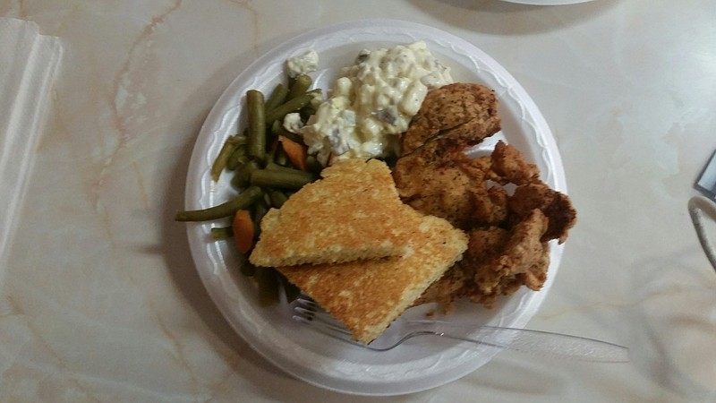 Kookie's Famous Fried Chicken deserves its fame for the light crispy crust and juicy bird. It's served here with sides of green beans and potato salad, plus cornbread.