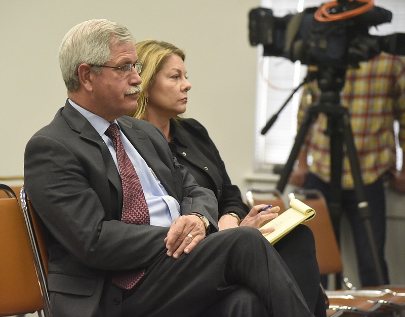 Hamilton County Schools Superintendent Rick Smith, left, listens with his attorney, Leah Gerbitz, during a called session of the Hamilton County Board of Education Monday.