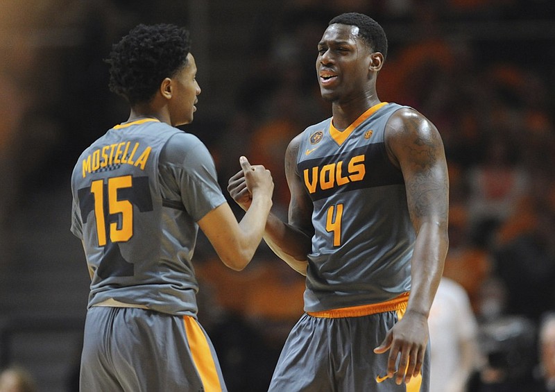 Tennessee forward Armani Moore (4) and guard Detrick Mostella (15) trade high-fives during the second half of an NCAA college basketball game against Tennessee, Saturday, March 5, 2016, in Knoxville, Tenn. (Adam Lau/Knoxville News Sentinel via AP) MANDATORY CREDIT