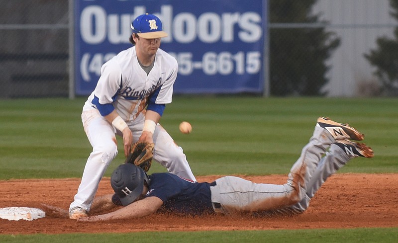 Ringgold's Hunter Foskey misses the ball at second as Heritage's Luke Grant slides in safely Tuesday, March 8, 2016 at Ringgold High School.