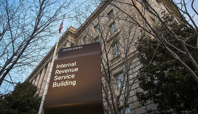 
              FILE - This April 13, 2014, file photo, shows the Internal Revenue Service headquarters building in Washington. Efforts to combat an escalating tax fraud problem are keeping thousands of legitimate filers from receiving their much-anticipated injection of tax return cash. Tax filers who opt to have their refund deposited directly onto debit cards are finding their cards frozen. The IRS said refund fraud caused by identity theft is one of its biggest challenges. In 2015, it stopped 1.4 million confirmed identity theft returns, totaling $8.7 billion. (AP Photo/J. David Ake, File)
            